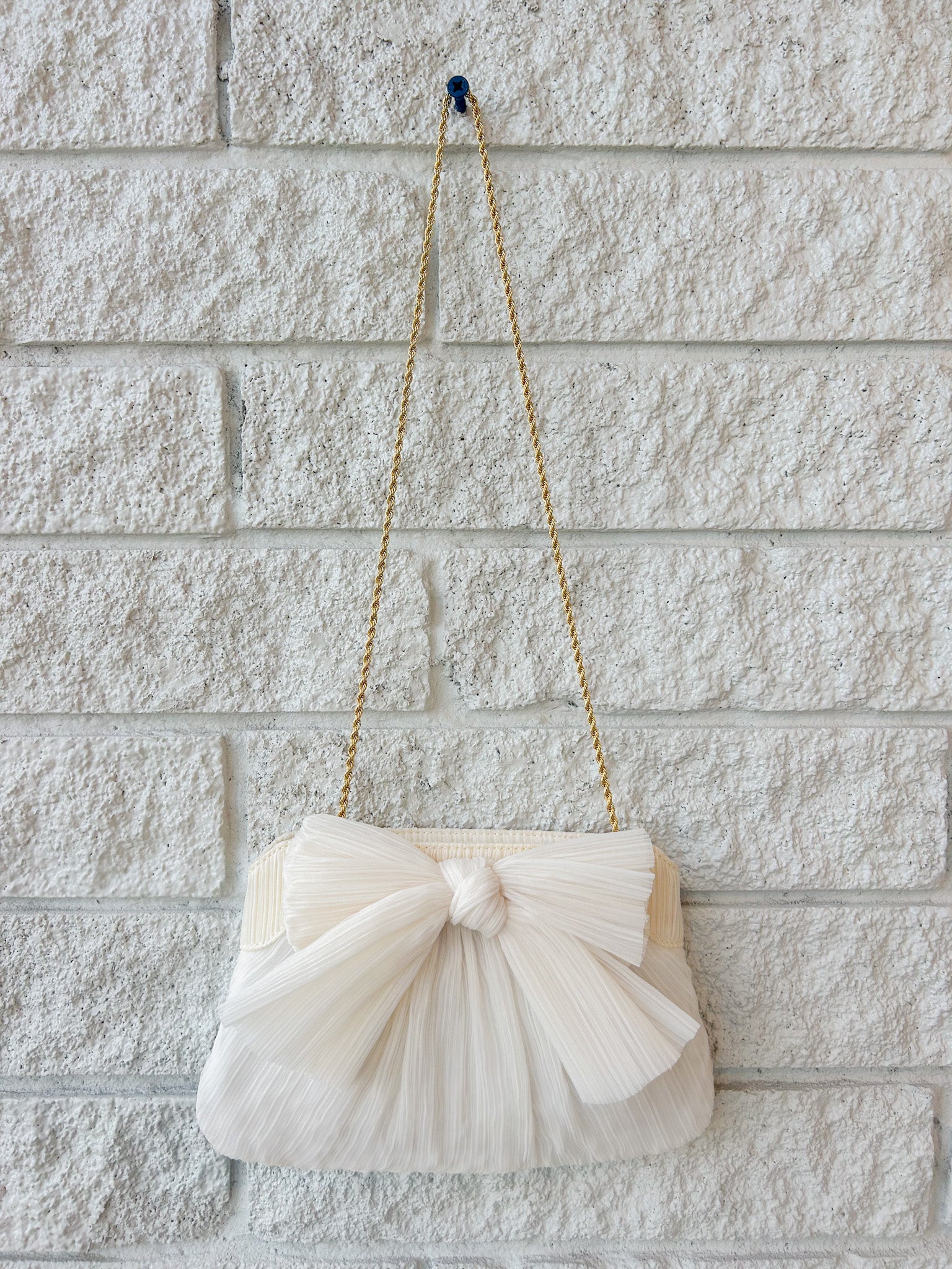 Rayne Pleated Bow Clutch