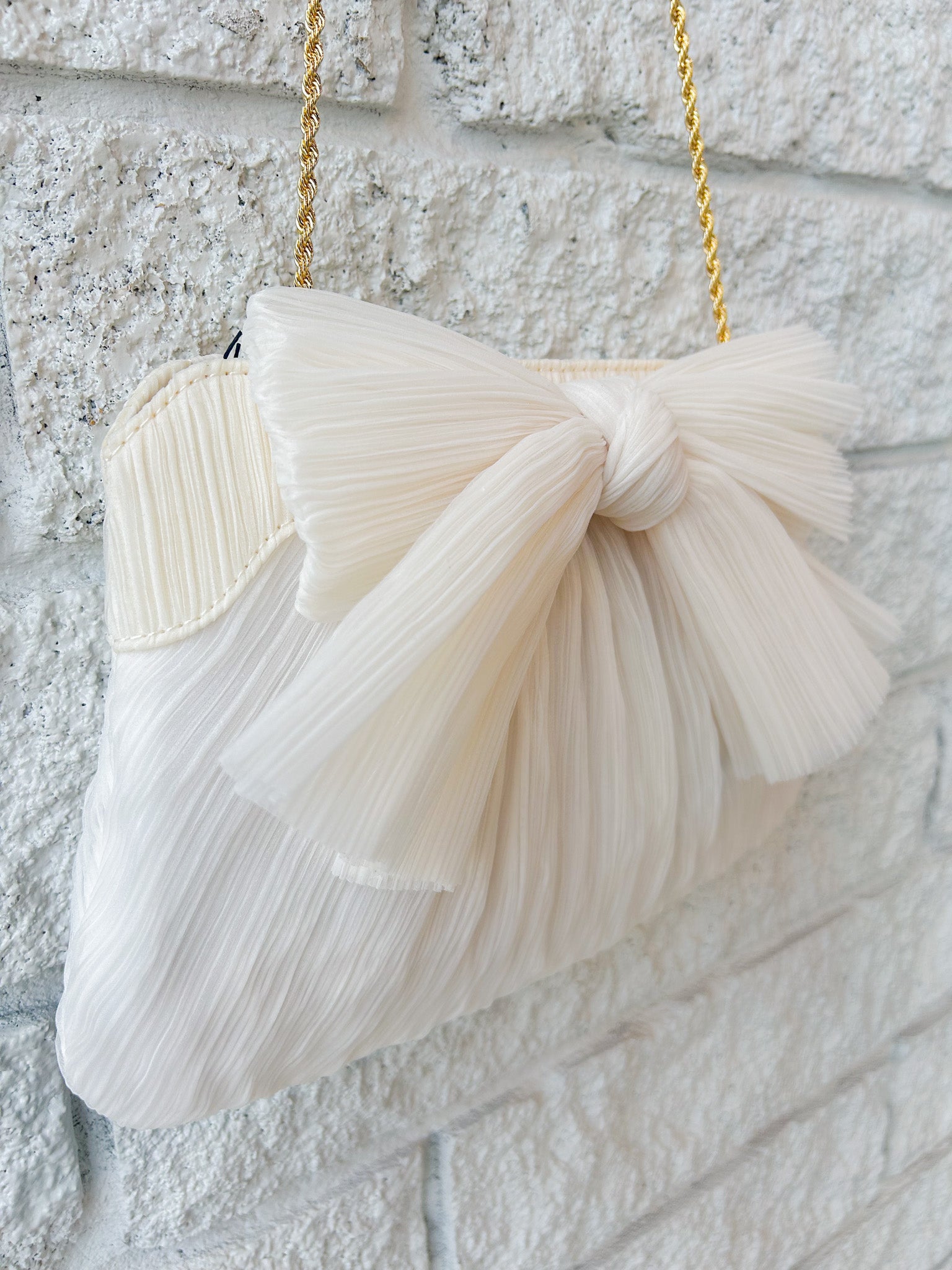 Rayne Pleated Bow Clutch